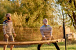 © Flamingo Images - Man playing volleyball with friends
