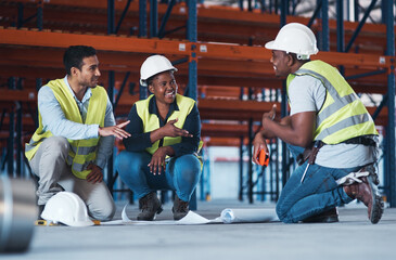 Sticker - What would you suggest. a group of contractors crouching down in the warehouse together and using a blueprint to plan.