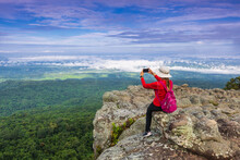 Young  Woman Hiking On Mountains. Lan-hin-pum, Phu Hin Rong Kla National Park, Phitsanulok Province , Thailand.