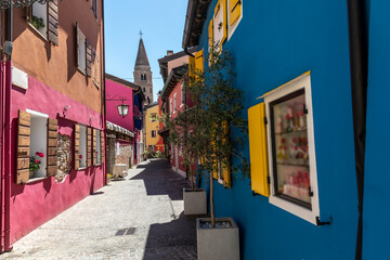 Narrow alley in the old town of Caorle, Italy