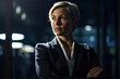 © ADDICTIVE STOCK - Generative AI illustration of confident adult female entrepreneur in elegant suit looking away while standing with folded arms against glass window in dark office room