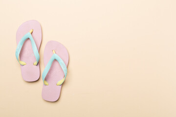 Wall Mural - Bright flip flops on color background, top view