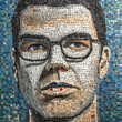 © ADDICTIVE STOCK - Generative AI illustration of male portrait in glasses with dark hair and blue eyes made of many small mosaic pieces