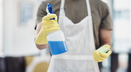 Wall Mural - Keeping home a germ free zone. an unrecognisable man using rubber gloves and disinfectant to clean his home.