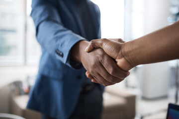 Thank you for agreeing to meet me. Closeup shot of two unrecognisable businesspeople shaking hands in an office.