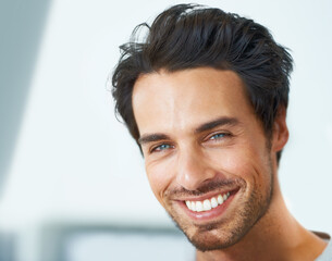 Wall Mural - Melting womens hearts wherever he goes. Cropped portrait of a handsome young man smiling broadly.