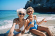 two stylish senior women having fun at the beach making selfies. generative ai