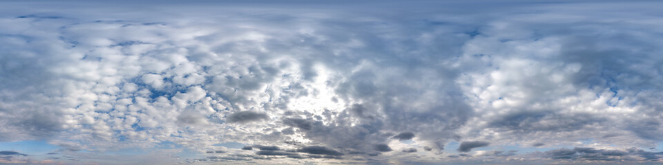 Wall Mural - overcast blue sky with cumulus clouds as seamless hdri 360 panorama with zenith in spherical equirec