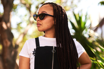 Aufkleber - I only see fun times ahead. an attractive young woman wearing sunglasses relaxing in a park outdoors.