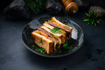 Sticker - Fresh sandwich with beef cutlet, pickled cucumber, tomatoes, lettuce and greens.