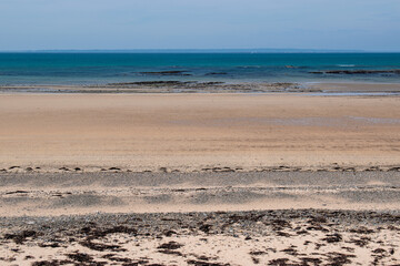 Wall Mural - La plage de Portbail dans le Cotentin avec en face l'ile de Jersey, Normandie, France