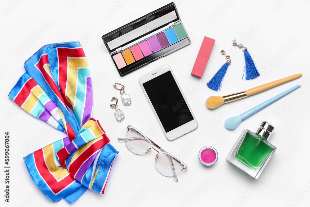 Composition with modern mobile phone, cosmetics and female accessories on white background