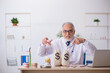 © Elnur - Old male doctor dentist in remuneration concept