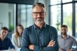 © Adriana - Smiling confident mature businessman looking at camera standing in office. Elegant stylish corporate leader successful ceo executive manager wearing glasses. Generative ai