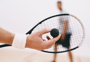 Poster - Time to serve up some serious squash skills. a man serving a ball with a racket during a game of squash.