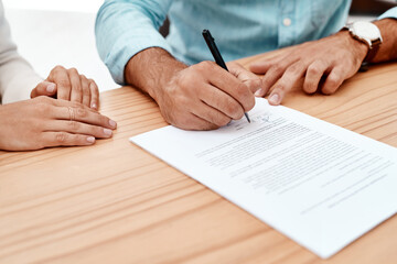 Canvas Print - Signing on the dotted line. two unrecognizable young business colleagues going over some documents in the boardroom.