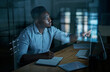 © Nicholas Felix/peopleimages.com - Having goals gives you focus. a young businessman writing in a notebook and using a computer during a late night at work.