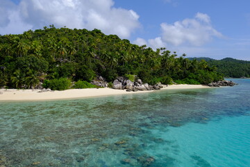  Indonesia Anambas Islands - Telaga Island coast with rocks and palm trees