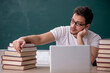 © Elnur - Young male student sitting in the classroom