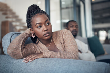 Sticker - Is this relationship what I really want. a young couple sitting on the sofa and giving each other the silent treatment after an argument.