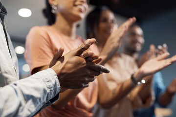 Sticker - The approval of our peers push us forward. a group of businesspeople clapping during a meeting in a modern office.