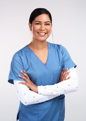 Wall Mural - From Bangkok to Calgary, your best shot IS me. Portrait of a beautiful young doctor standing with arms folded against a white background.