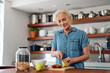 © Nicholas Felix/peopleimages.com - Get your fill of wellness with a healthy breakfast. a mature woman preparing a healthy breakfast in the kitchen at home.