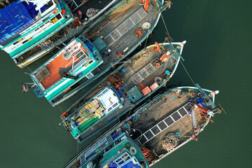 Wall Mural - asian fisherman boat ,docks at the harbor