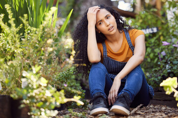 Canvas Print - Everyone needs a break from time to time. a young female florist suffering from a headache at work.