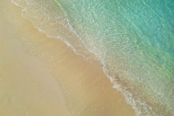 Canvas Print - aerial view with drone ,of waves on tropical white sand beach 