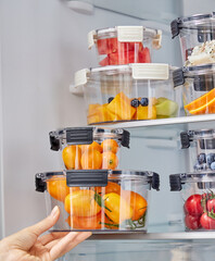 Various vegetables and fruits in glass crisper, indoor kitchen scene, healthy lifestyle