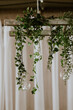 Hanging wedding vines above reception with candles