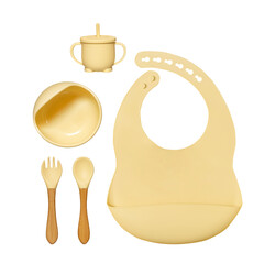 Silicone dishware on grey background. Serving baby, first feeding concept. Baby food accessory