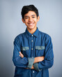 © Hova/peopleimages.com - Smile, happy and portrait of teenager with fashion feeling confident arms crossed isolated in a gray studio background. Content, happiness and young Arab teen male person or teen with style