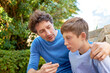 © Mariusz/peopleimages.com - Family, father talking with son in backyard, bonding with love and care, communication and relationship. Man with sad teen boy, help with advice at home and outdoor together with trust and support