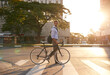 © Marius V/peopleimages.com - Morning, bike and business man in city for commute, travel and carbon footprint. Cycling, transportation and urban with male employee walking on crosswalk for journey, transit and professional
