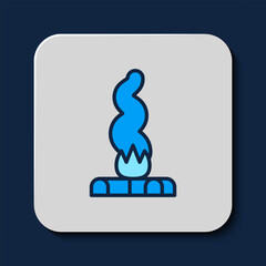 Sticker - Filled outline Campfire icon isolated on blue background. Burning bonfire with wood. Vector