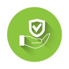 Sticker - White Shield in hand icon isolated with long shadow background. Insurance concept. Guard sign. Security, safety, protection, privacy concept. Green circle button. Vector