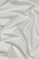 abstract smooth elegant white fabric silk texture soft background, flowing satin waves. Luxurious background design