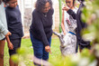 © Austockphoto - Aboriginal family playing with their dog in the backyard