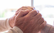 Old people holding hands close up view, senior retired family couple express care as psychological support concept, trust in happy marriage, empathy hope