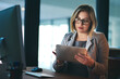 © Jadon Bester/peopleimages.com - Using technology to brush up on some final touches. a young businesswoman working late on a digital tablet in an office.