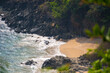 High angle shot of a tropical beach as seen from above the mountain. Kakolem beach as seen from above the hill at South Goa in India. Sea waves crashing on the shore as seen from above hill.