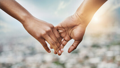 Poster - Theres no letting go. Closeup shot of an unrecognizable couple holding hands together outdoors.