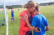 © Astrakan Images - Mother comforting son (10-11, 12-13) during soccer practice