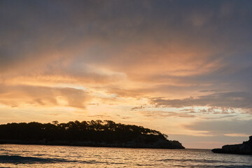 Wall Mural - Dawn on the S'Amarador beach on the island of Mallorca. Balearic Islands. Spain