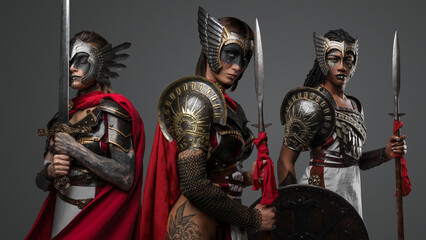 Canvas Print - Studio shot of isolated on gray background amazons from past with make up.