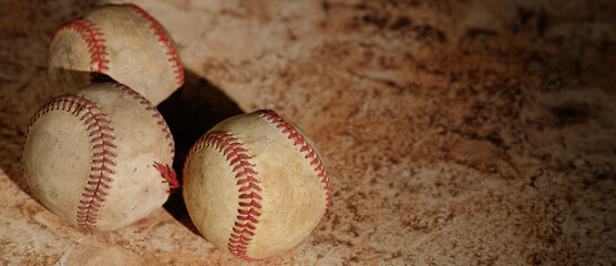 Wall Mural - Old vintage baseball balls with brown texture banner background.