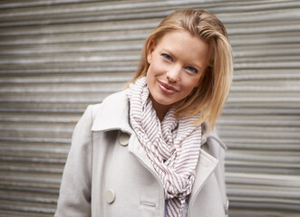 Wall Mural - Shes looking stylish this season. Cropped portrait of a pretty young blonde in warm winter fashion.