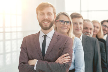 Poster - close up. smiling business people standing in one after another.